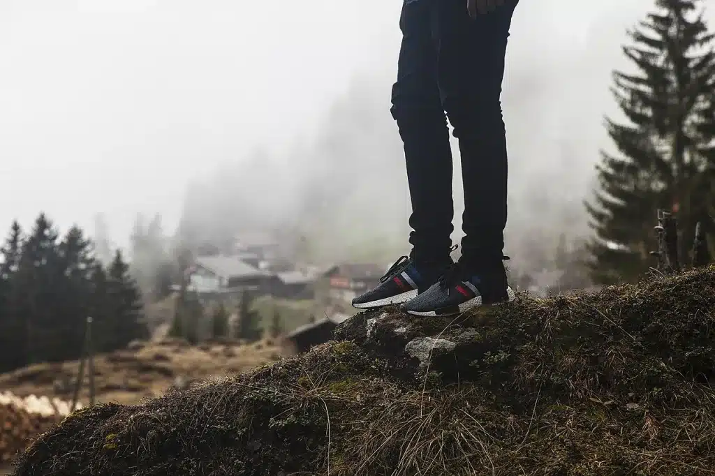 Close up of walking shoes mid step outdoors